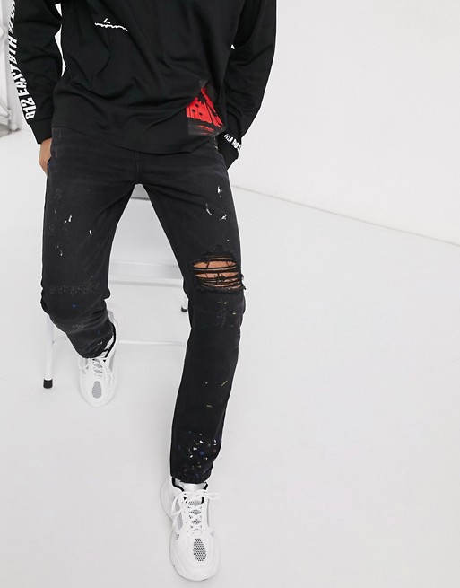 boohooMAN slim rigid distressed jeans with paint splatter in grey