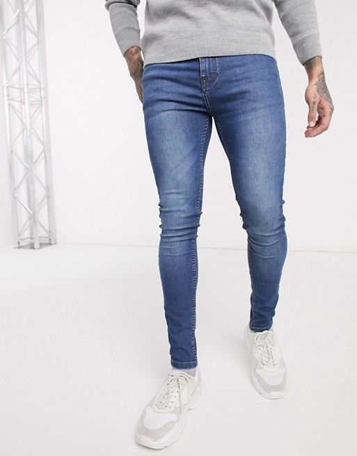 boohooMAN super skinny jeans in mid wash blue