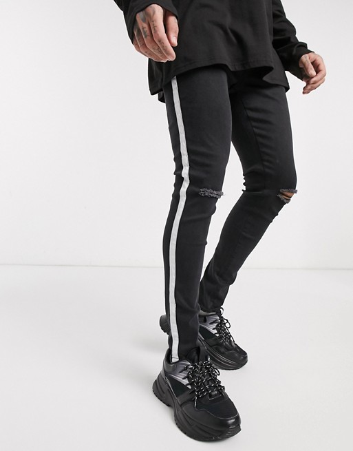 boohooMAN super skinny jeans with side tape in black