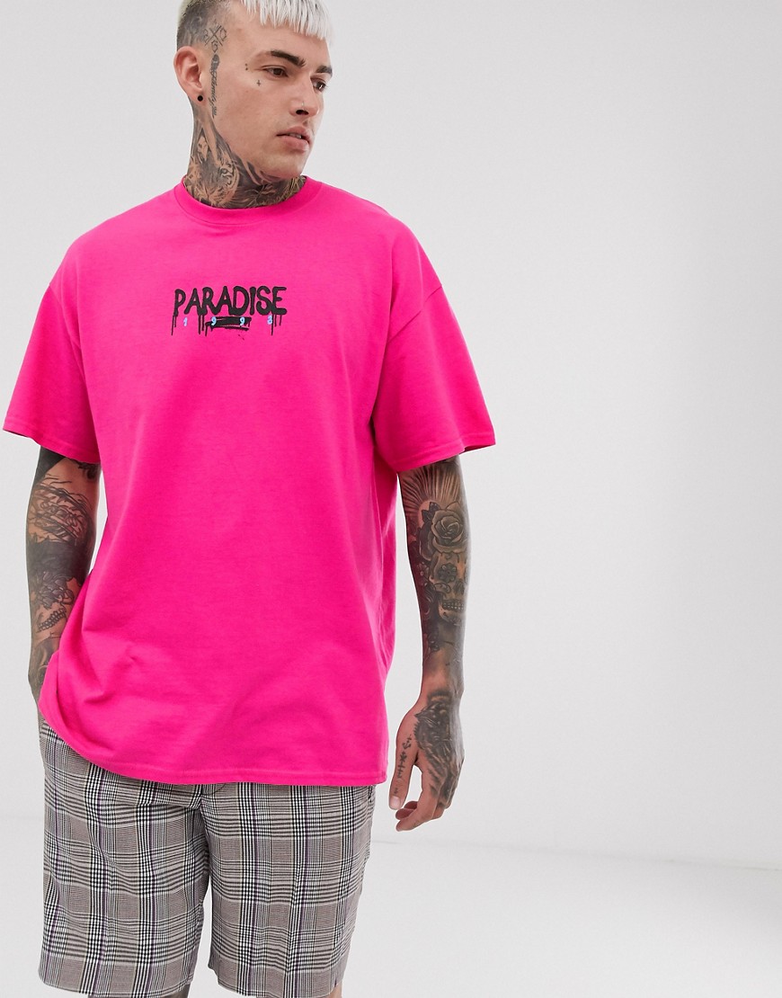boohooMAN - T-shirt oversize rosa con stampa paradise spray