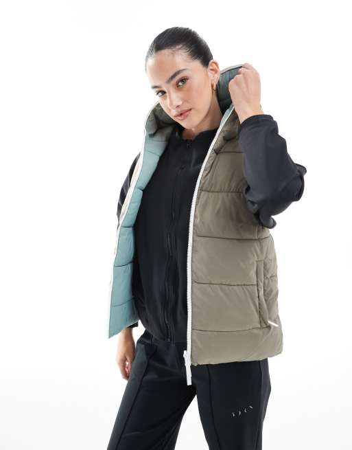 Born Living Yoga - Hazel - Omkeerbare sport bodywarmer in bruin en blauw