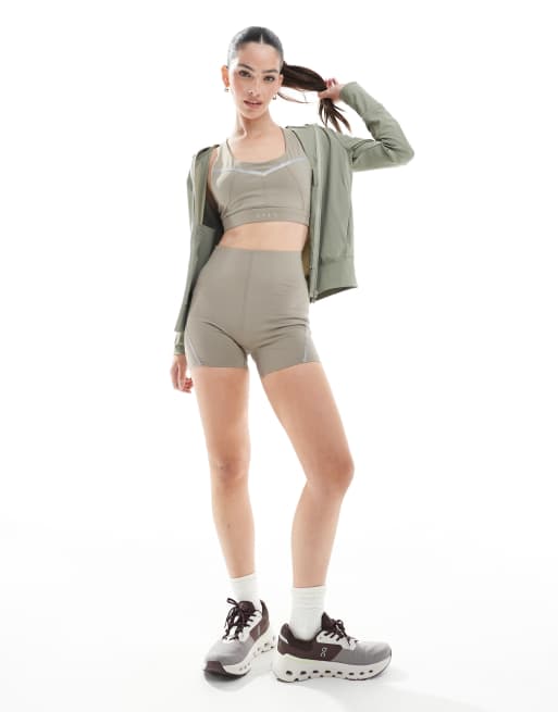 Born Living Yoga - Luna - Shorts met reflecterende strepen in bruin