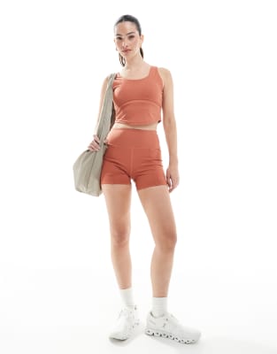 Born Living Yoga - Sayani - Shorts in Marsala mit Gesäßtasche-Orange