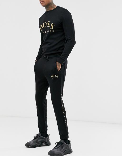 BOSS Athleisure gold logo cuffed joggers in black ASOS