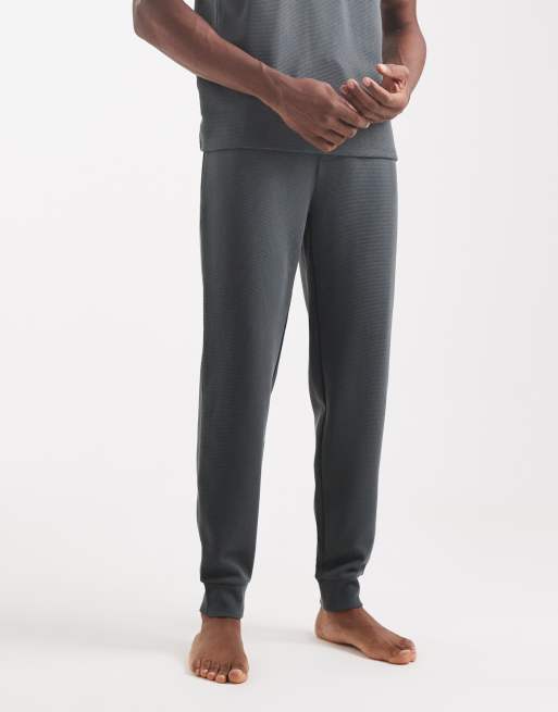 BOSS Bodywear - Joggers da casa verde medio lavorati a nido d'ape con fondo elasticizzato in coordinato