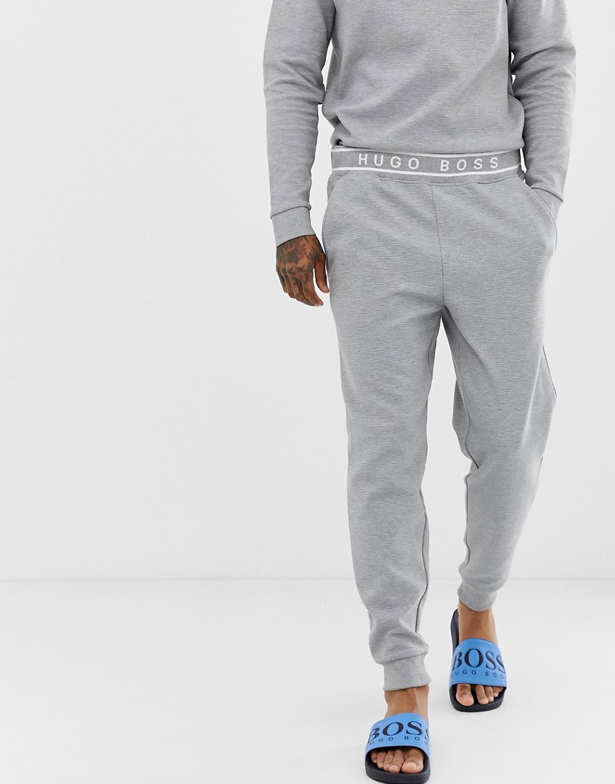 BOSS Bodywear - Joggers in piqué testurizzato con fondo elasticizzato ed elastico in vita con logo-Grigio
