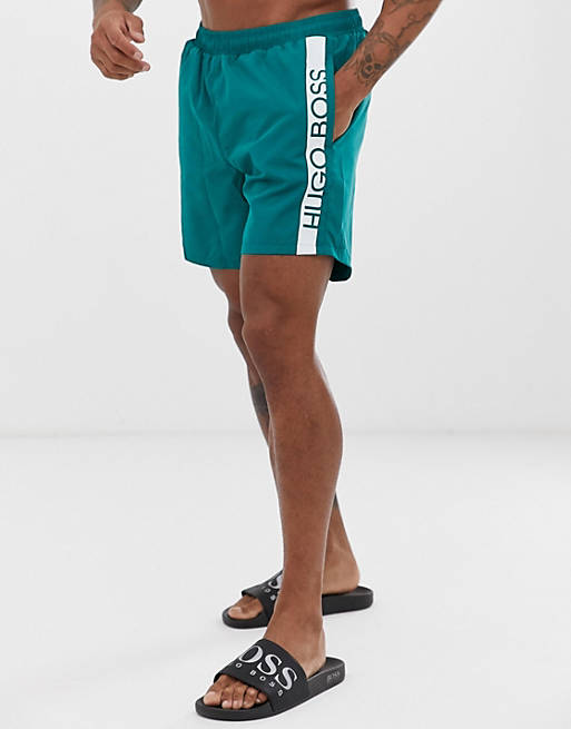 BOSS Dolphin logo swim shorts in green | ASOS