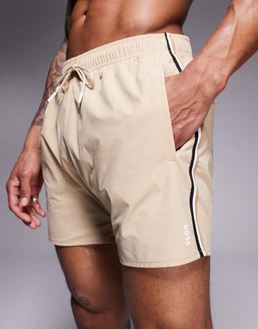 BOSS Iconic side stripe logo swim shorts in light beige ASOS