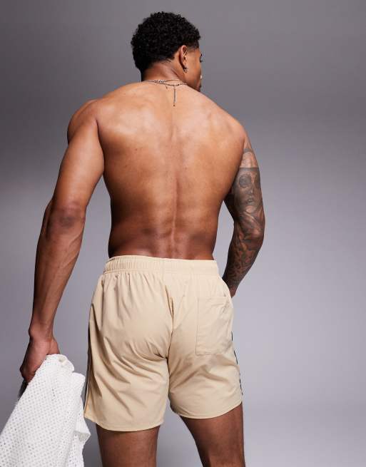 BOSS Iconic side stripe logo swim shorts in light beige ASOS