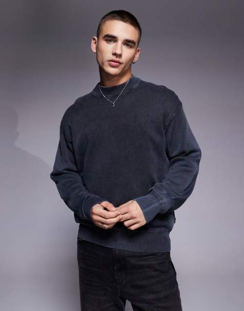BOSS Orange – Akapulk – Überfärbter Strickpullover aus Baumwolle in Mittelblau mit lockerem Schnitt und farblich abgestimmtem Logo - view 1