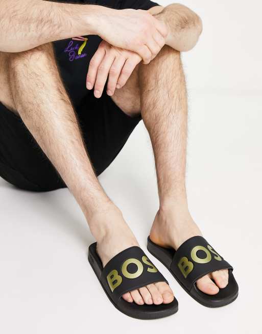 BOSS Orange - Aryeh - Sorte sliders med guldfarvet logo