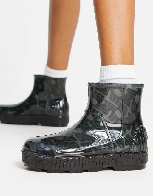 Botas de agua negras con estampado gr fico del monograma Drizlita de UGG