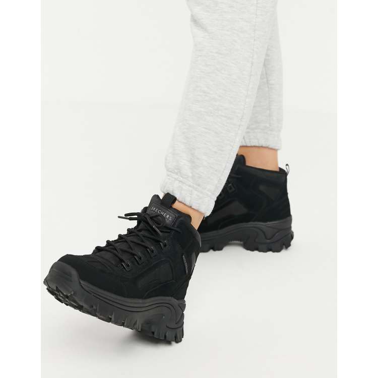 Botas negras de monta a con suela plana Street Blox de Skechers ASOS