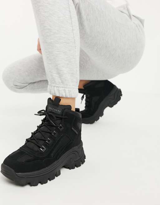 Botas negras de monta a con suela plana Street Blox de Skechers ASOS