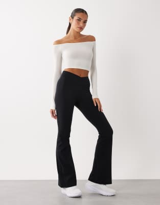 Bo+tee Cross Over Waistband Flare Leggings In Black