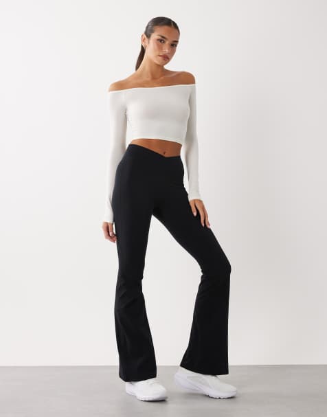 Bo+Tee cross over waistband flare leggings in black - view 1