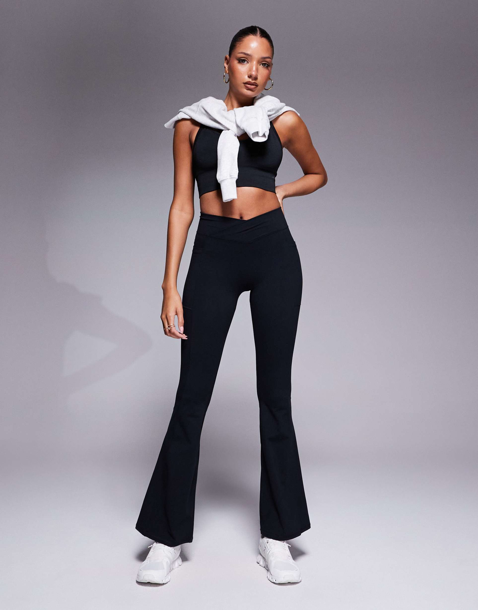 bo+tee cross waistband flare leggings in black