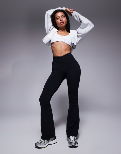 Bo+Tee Petite cross waistband flare leggings in black