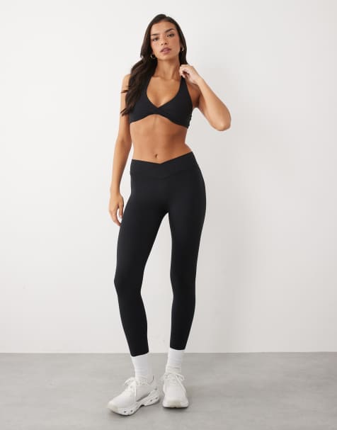 Bo+Tee soft active halter neck sports bra and cross over waistband legging co-ord in black - view 1