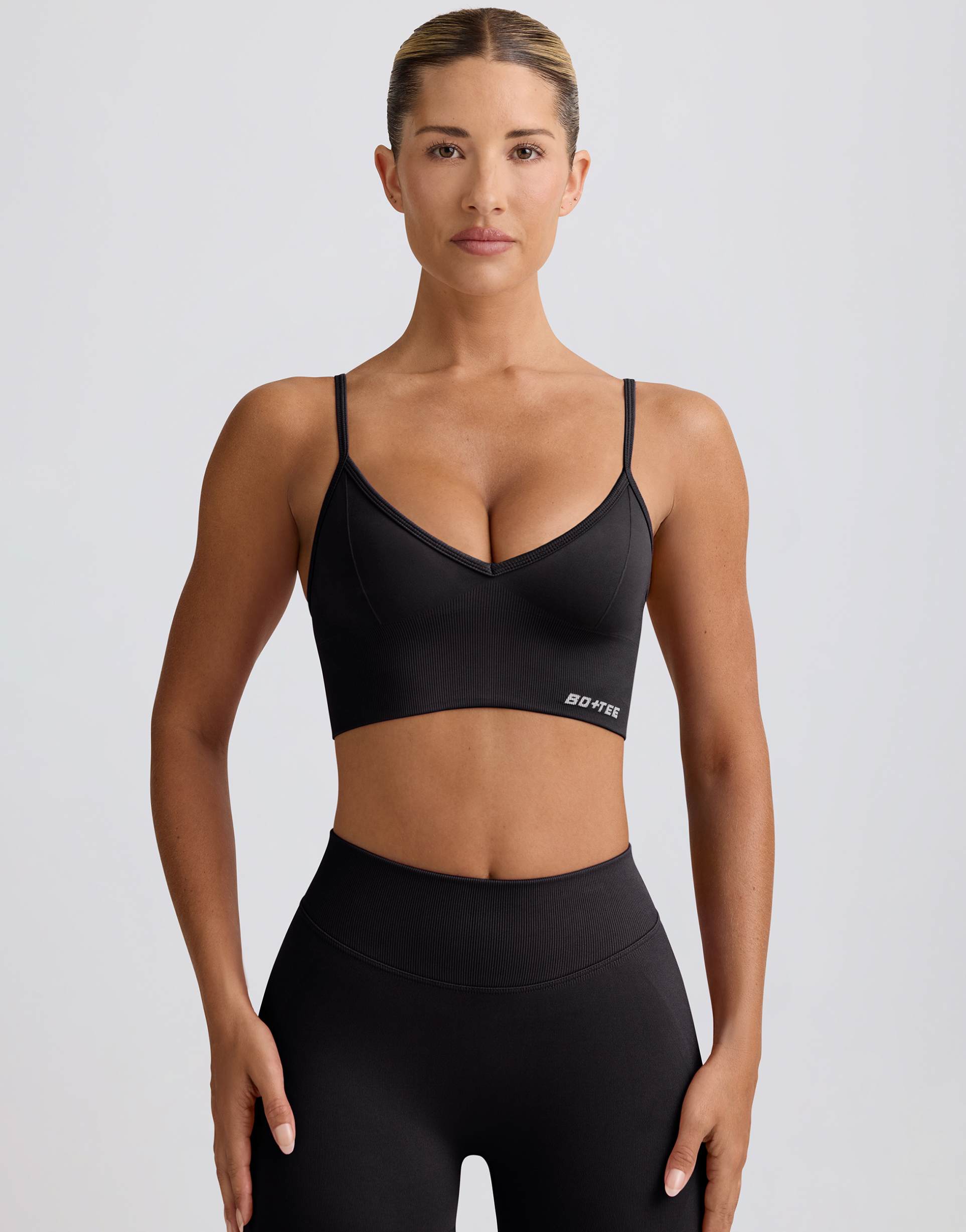 bo+tee v-neck define seamless cami sports bra in black - part of a set