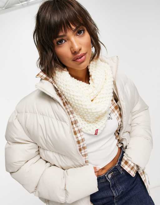 Braga color crema con logo de punto de Levi's