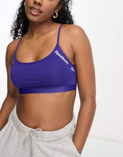 Dinamarca Bloquear Motivación Bralette morado intenso con tirantes en la espalda Cyra de Reebok | ASOS