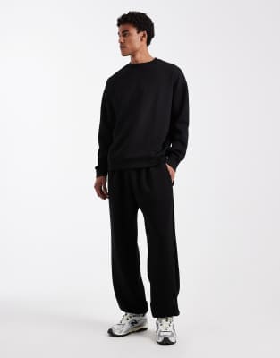 Jogginghose aus Material in Neoprenoptik in Schwarz, Kombiteil Schwarz W34-36