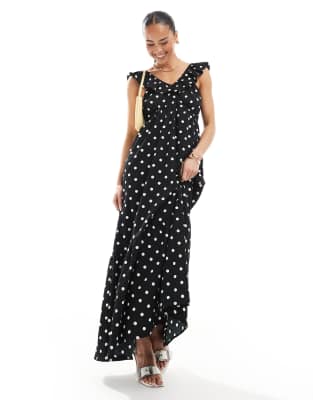 polka dot maxi dress with ruffle detail in black