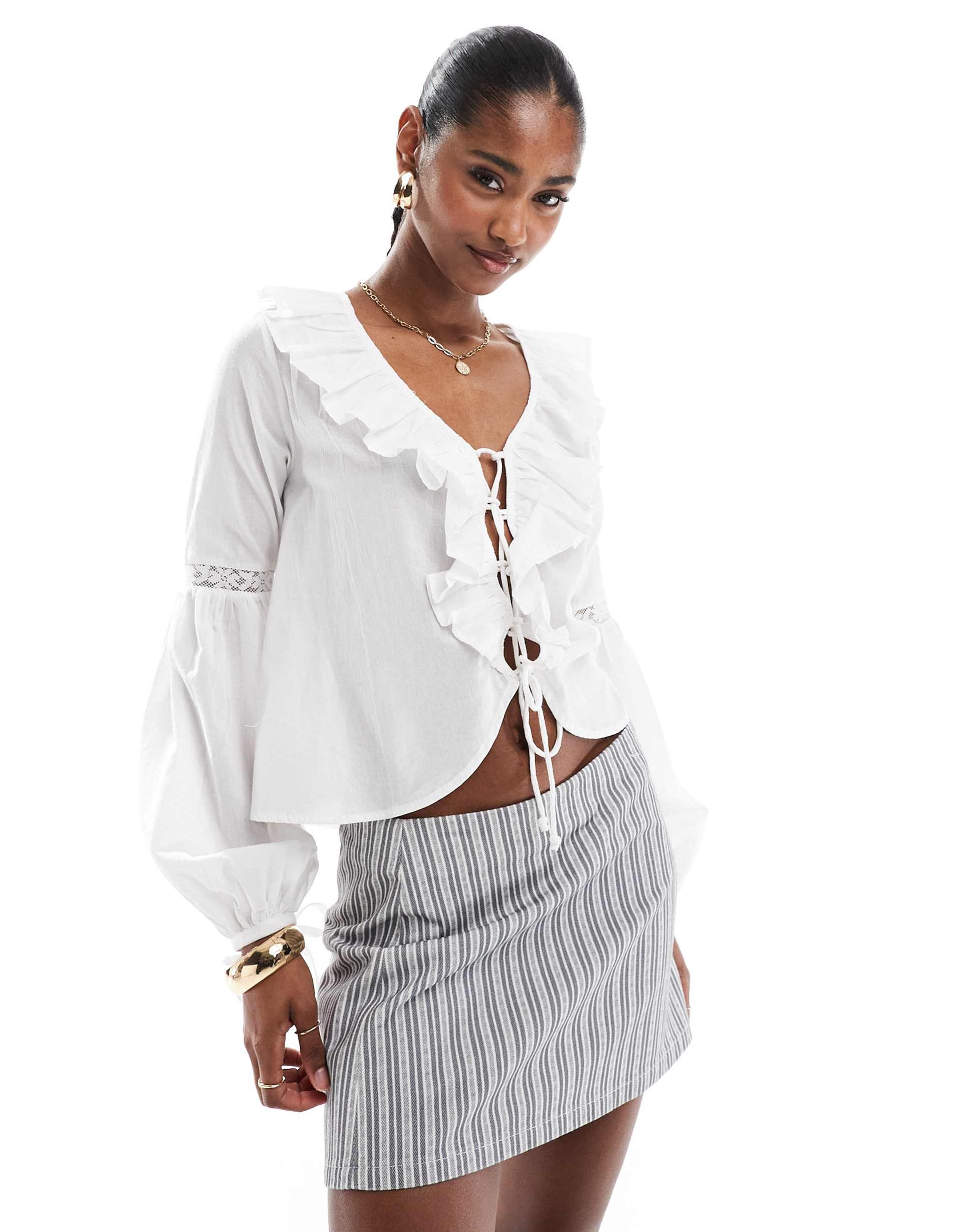 brave soul ruffle front long sleeve blouse in white
