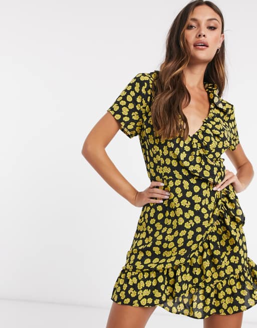 Brave Soul ruffle wrap mini dress in black with daisy print | ASOS