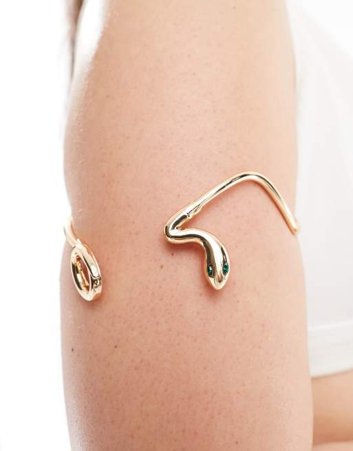 Brazalete dorado con diseño envolvente de serpiente de ASOS DESIGN Curve