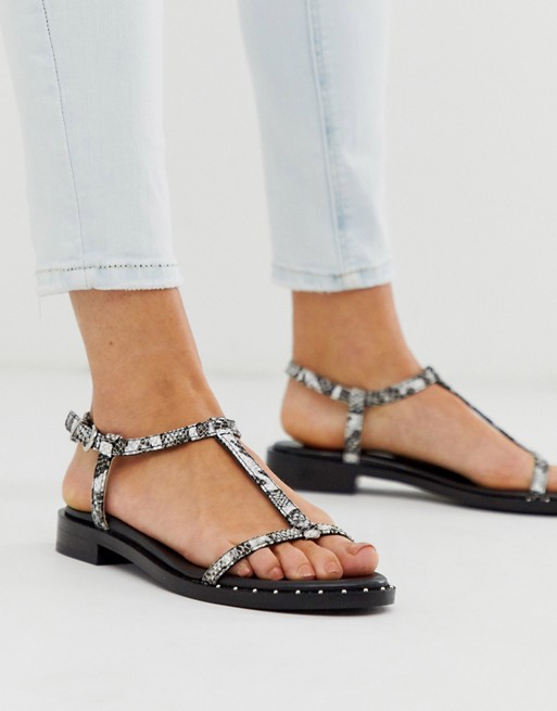 Bronx leather strappy sandals in black and white snake