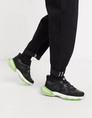 neon green and black trainers