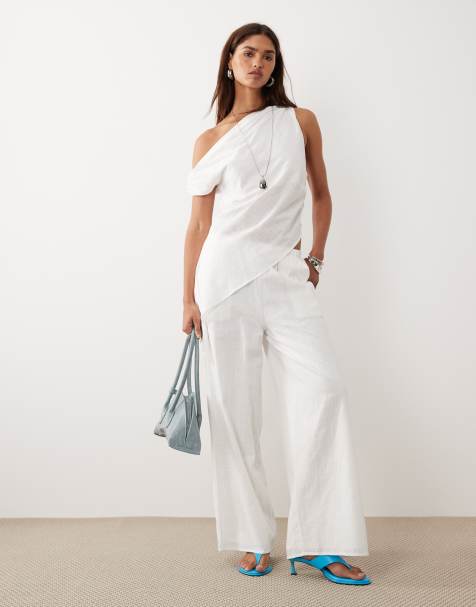 Bronze Snake Tasi off shoulder asymetric top and trouser set in white
