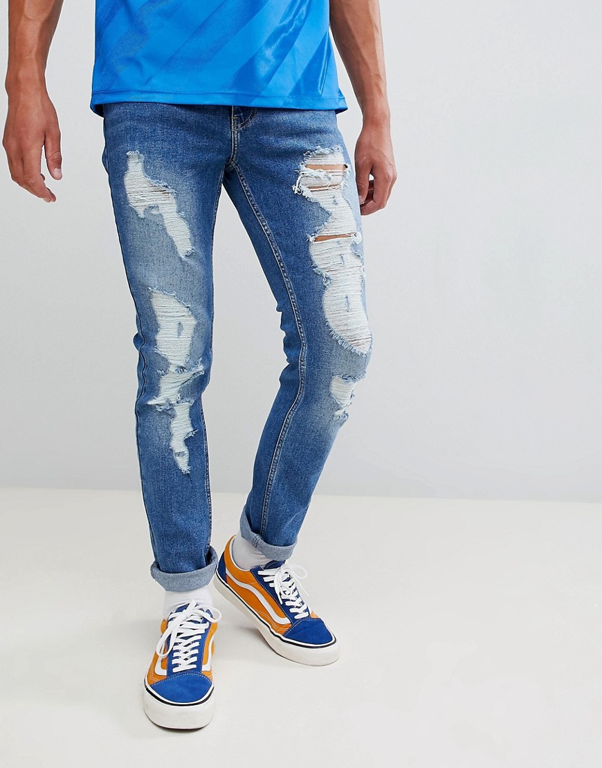 Brooklyn Supply Co - Jeans skinny con strappi lavaggio stone wash blu