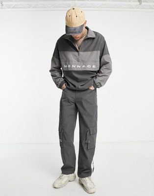 фото Брюки карго свободного кроя выбеленного черного цвета с ремешками и накладными карманами mennace-серый
