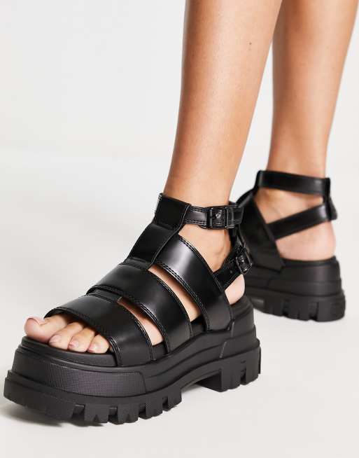 Buffalo Aspha GLD vegan-friendly platform sandals in black | ASOS