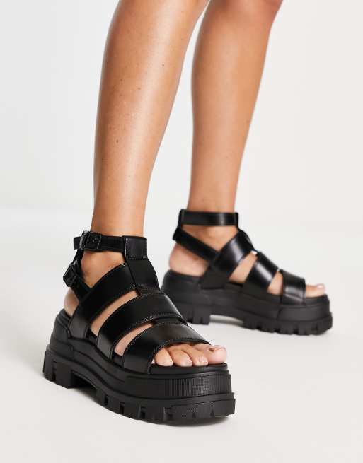 Buffalo Aspha GLD vegan platform sandals in black | ASOS