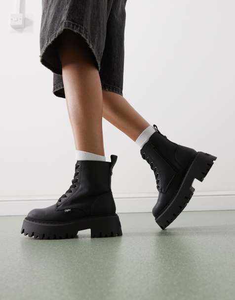 Buffalo faux fur lined boots in black - view 1