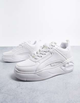 white flat trainers