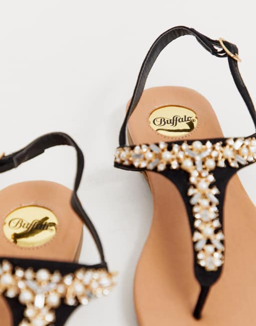 Flat thong store sandals with rhinestones