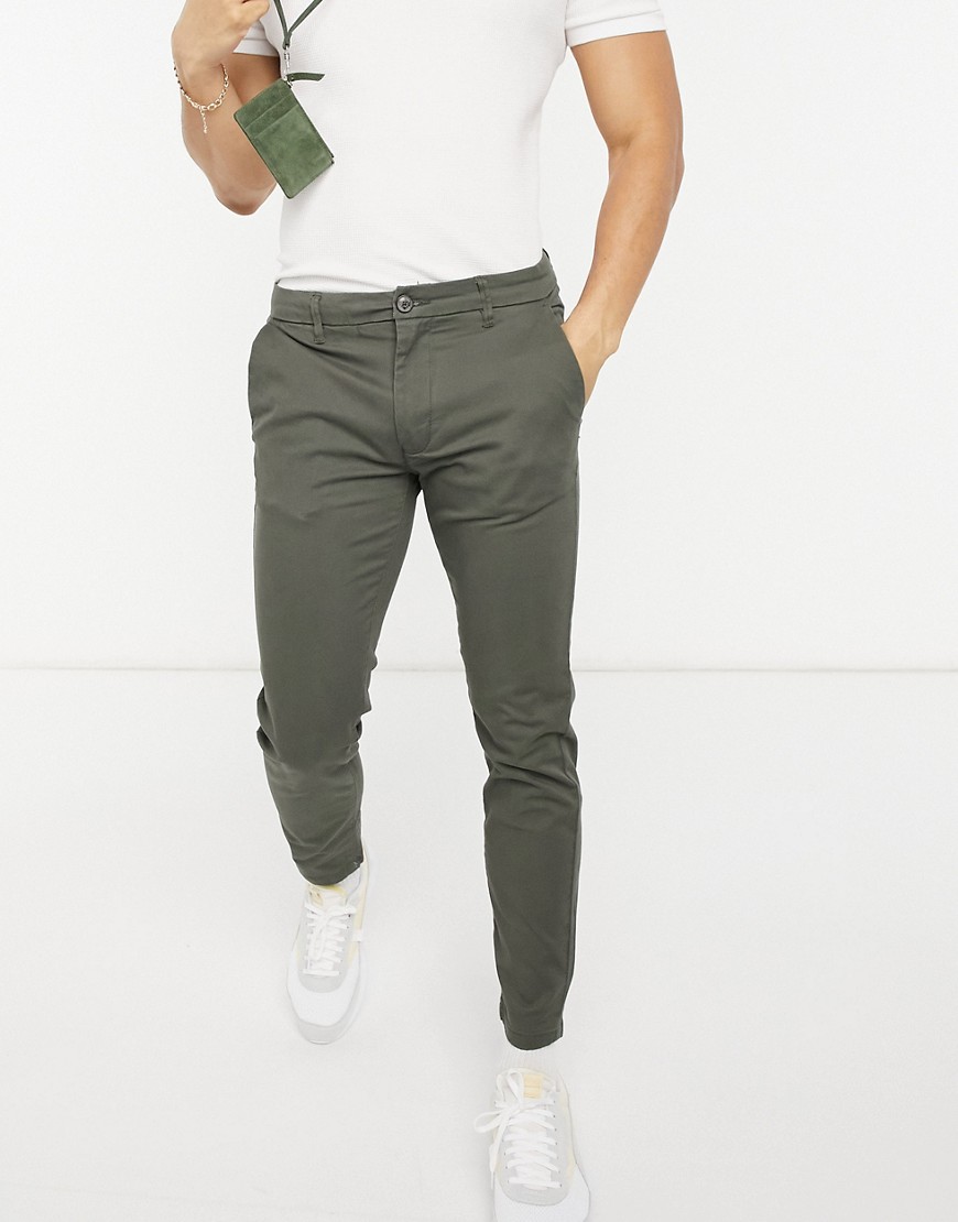 Burton Menswear – Khakifärgade chinos i stretch med extra smal passform-Grön