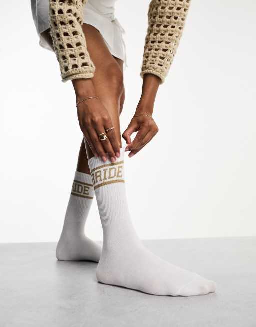 Calcetines blancos y dorados con estampado 
