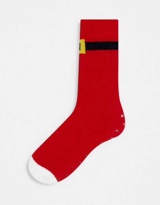 Calcetines de estar por casa rojos de Navidad con diseño de cinturón de Papá Noel de ASOS DESIGN
