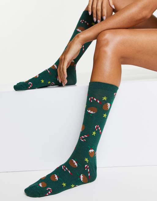 Calcetines de media caña verdes con diseño navideño y estampado de bastones de caramelo de ASOS DESIGN