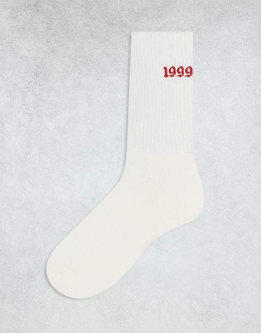 Calcetines deportivos blancos con bordado 