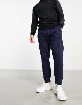 Calvin Klein Golf Calvin Klein AOP monogram joggers in navy exclusive to ASOS