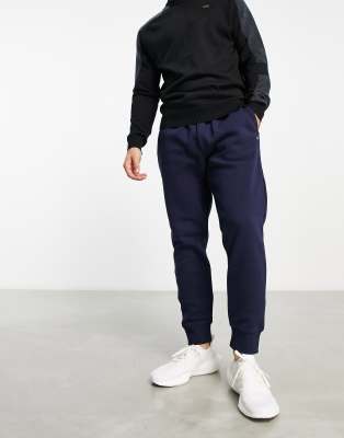 Calvin Klein AOP monogram joggers in navy exclusive to ASOS