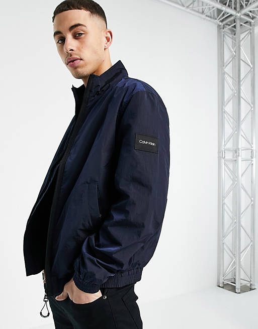 Calvin Klein badge logo crinkle nylon harrington jacket in navy | ASOS