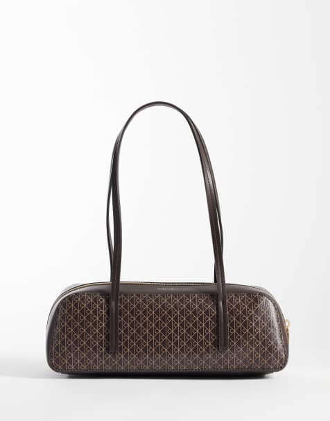 Calvin Klein bauletto bag with emblem print in chocolate brown - view 1